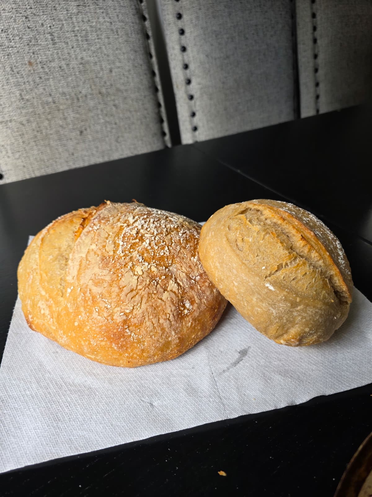 Two fresh golden sourdough loaves from The Chef’s Daughter